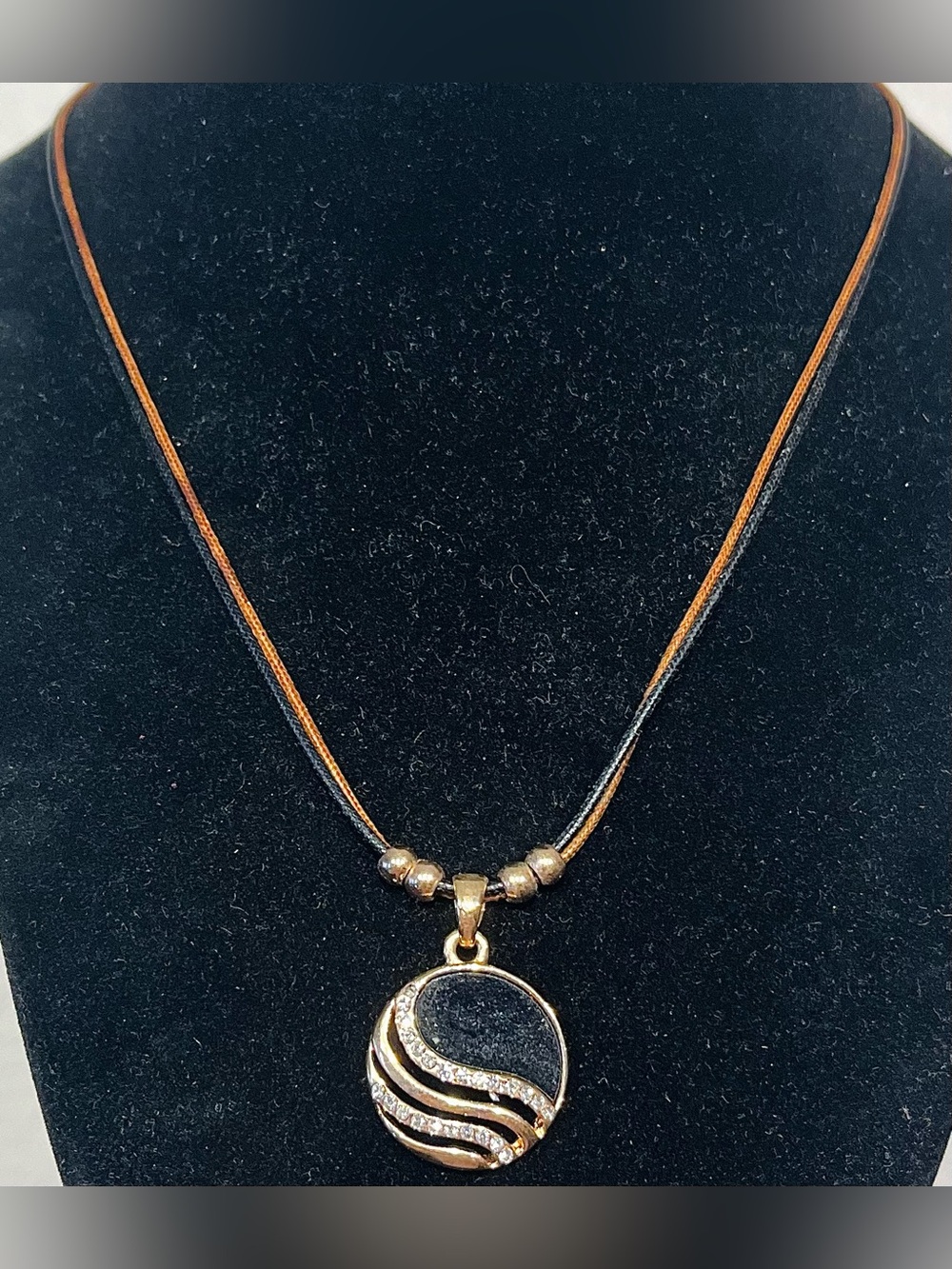 Gold-Tone Black Pendant Necklace with Crystal Accents